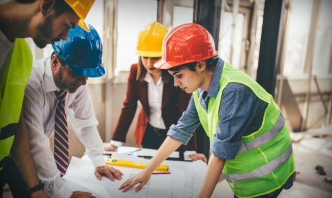 Construction team reviewing plans on a jobsite
